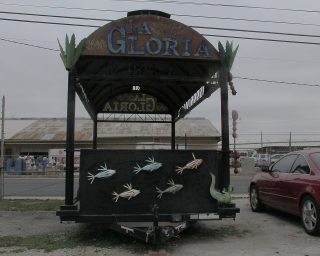 A custom metal towable booth labeled La Gloria